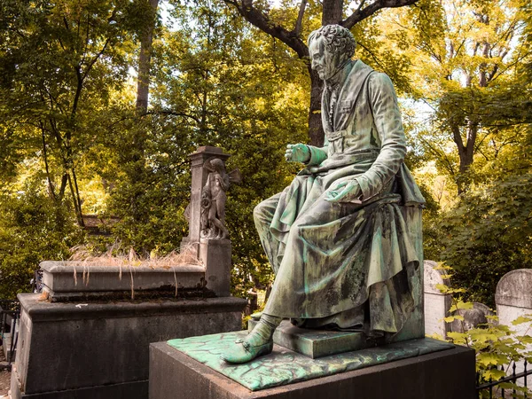 Statue on the grave of Vivant Denon in the famous Pere Lachaise cemetery in Paris, France. The cemetery is a tourist destination since many famous people sleep there.