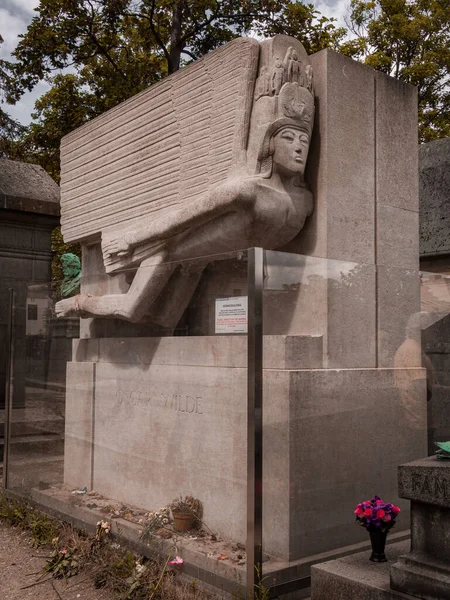 Grave of Oscar Wilde in the famous Pere Lachaise cemetery. The cemetery is a tourist destination since many famous people sleep in it. June 6, 2022.