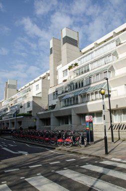 London, UK - March 21, 2022: View of the brutalist architecture of the Brunswick Centre in Bloomsbury, Central London.  Seen from Marchmont Street, the design by Patrick Hodgkinson has tiers of flats together with ventillation towers.  At ground leve