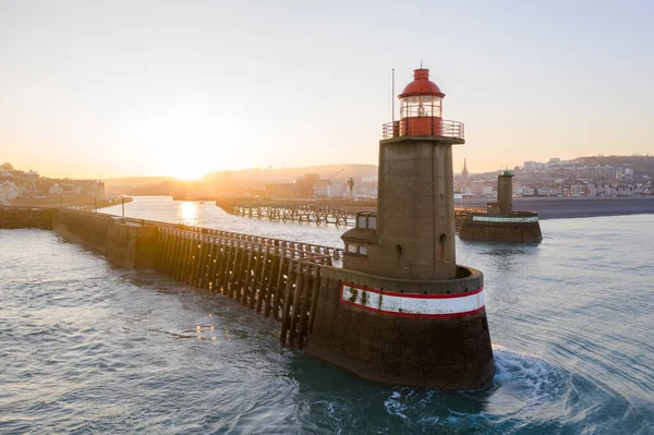 Aerial view of the lighthouses of Fcamp in Normandy in France at sunrise. Coastal cliffs and city from a drone