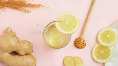 ginger tea with lemon and honey on a white background