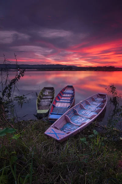 Focal point 3 boats anchored by the lake in summer with evening feel. high quality photos