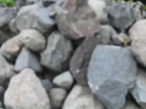defocused piles of stone abstract background
