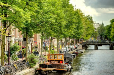 Amsterdam, Netherlands - August 2021: Historical center in cloudy weather, HDR Image