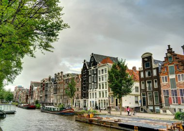 Amsterdam, Netherlands - August 2021: Historical center in cloudy weather, HDR Image