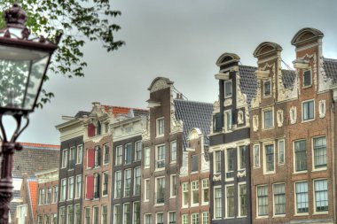 Amsterdam, Netherlands - August 2021: Historical center in cloudy weather, HDR Image