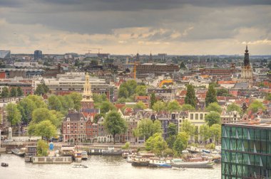 Amsterdam, Netherlands - August 2021: Historical center in cloudy weather, HDR Image