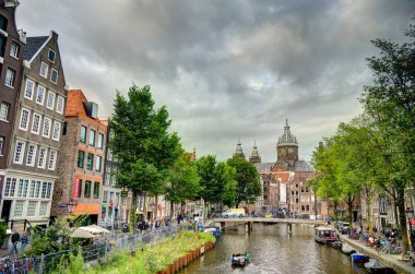 Amsterdam, Netherlands - August 2021: Historical center in cloudy weather, HDR Image