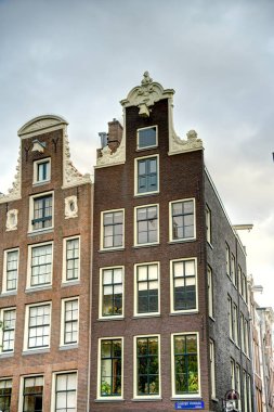 Amsterdam, Netherlands - August 2021: Historical center in cloudy weather, HDR Image