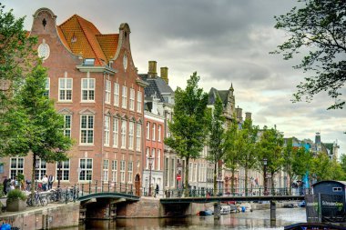 Amsterdam, Netherlands - August 2021: Historical center in cloudy weather, HDR Image