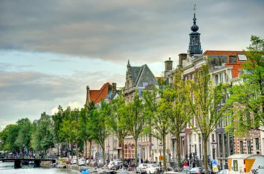 Amsterdam, Netherlands - August 2021: Historical center in cloudy weather, HDR Image
