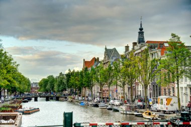 Amsterdam, Netherlands - August 2021: Historical center in cloudy weather, HDR Image