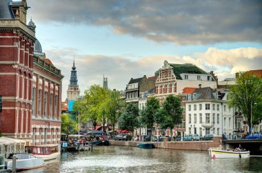 Amsterdam, Netherlands - August 2021: Historical center in cloudy weather, HDR Image