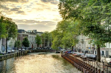 Amsterdam, Netherlands - August 2021: Historical center in cloudy weather, HDR Image