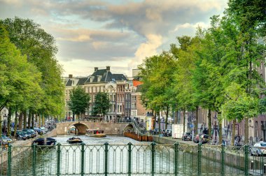 Amsterdam, Netherlands - August 2021: Historical center in cloudy weather, HDR Image