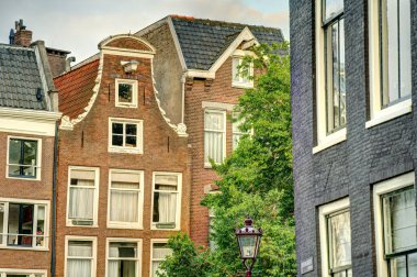 Amsterdam, Netherlands - August 2021: Historical center in cloudy weather, HDR Image