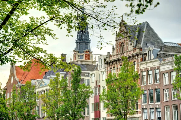 Amsterdam, Netherlands - August 2021: Historical center in cloudy weather, HDR Image