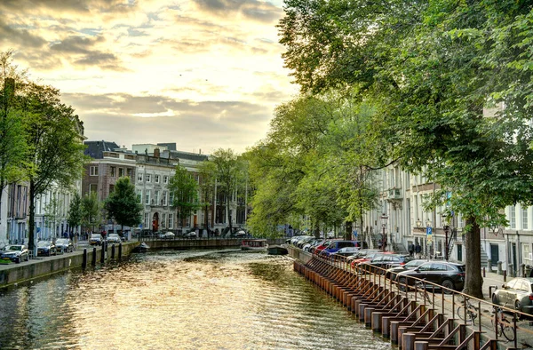 Amsterdam, Netherlands - August 2021: Historical center in cloudy weather, HDR Image
