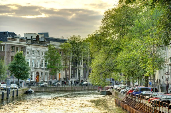 Amsterdam, Netherlands - August 2021: Historical center in cloudy weather, HDR Image