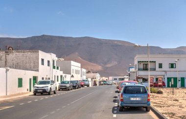 Caleta de Famara, Lanzarote - September 2020 : Picturesque seaside village in sunny weather, HDR Image
