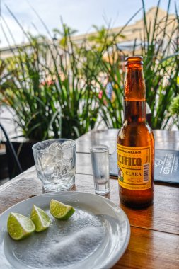 Mazatlan, Mexico - January 2022 :beer with lime and ice cubes on table