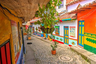 Guatape, Antioquia, Colombia - May 2019 : Colorful village in cloudy weather