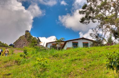 Guatape, Colombia - May 2019 : Rock of Guatape in cloudy weather
