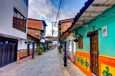 Guatape, Antioquia, Colombia - May 2019 : Colorful village in cloudy weather