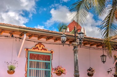 Guatape, Antioquia, Colombia - May 2019 : Colorful village in cloudy weather