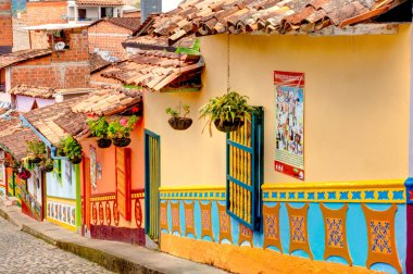 Guatape, Antioquia, Colombia - May 2019 : Colorful village in cloudy weather