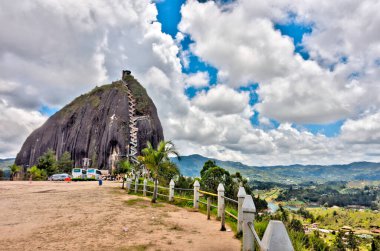 Guatape, Colombia - May 2019 : Rock of Guatape in cloudy weather