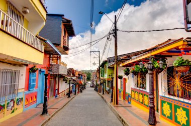 Guatape, Antioquia, Colombia - May 2019 : Colorful village in cloudy weather