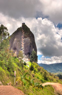 Guatape, Colombia - May 2019 : Rock of Guatape in cloudy weather