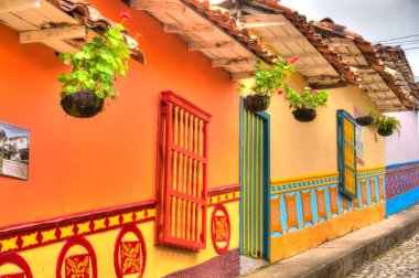 Guatape, Antioquia, Colombia - May 2019 : Colorful village in cloudy weather