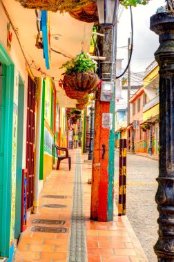 Guatape, Antioquia, Colombia - May 2019 : Colorful village in cloudy weather