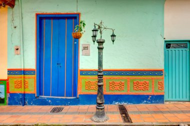 Guatape, Antioquia, Colombia - May 2019 : Colorful village in cloudy weather