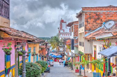 Guatape, Antioquia, Colombia - May 2019 : Colorful village in cloudy weather