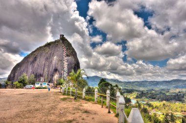 Guatape, Colombia - May 2019 : Rock of Guatape in cloudy weather