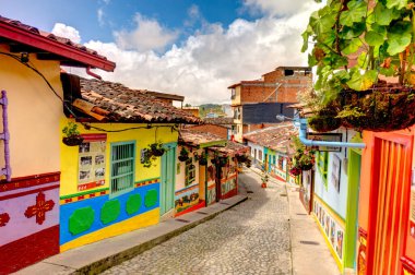 Guatape, Antioquia, Colombia - May 2019 : Colorful village in cloudy weather