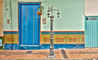 Guatape, Antioquia, Colombia - May 2019 : Colorful village in cloudy weather