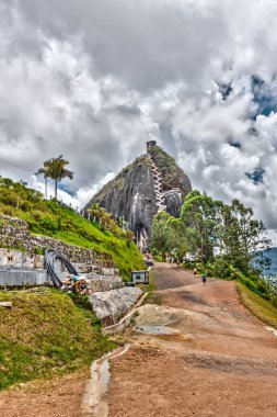 Guatape, Colombia - May 2019 : Rock of Guatape in cloudy weather