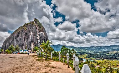 Guatape, Colombia - May 2019 : Rock of Guatape in cloudy weather
