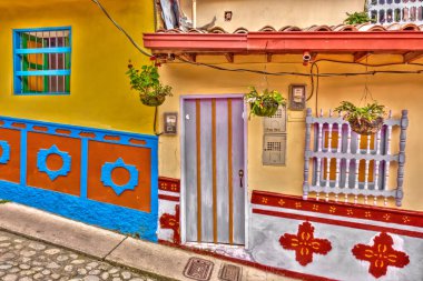 Guatape, Antioquia, Colombia - May 2019 : Colorful village in cloudy weather
