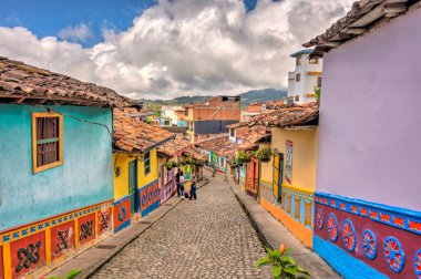 Guatape, Antioquia, Colombia - May 2019 : Colorful village in cloudy weather