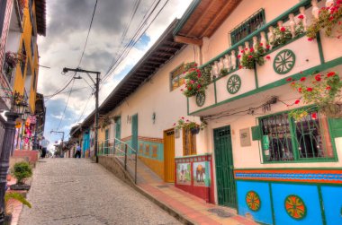 Guatape, Antioquia, Colombia - May 2019 : Colorful village in cloudy weather