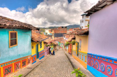 Guatape, Antioquia, Colombia - May 2019 : Colorful village in cloudy weather