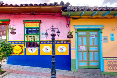 Guatape, Antioquia, Colombia - May 2019 : Colorful village in cloudy weather