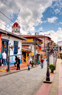 Guatape, Antioquia, Colombia - May 2019 : Colorful village in cloudy weather