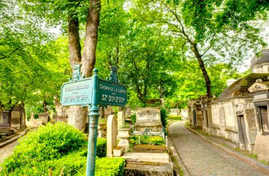 Paris, France - May 2019 : Pere Lachaise Cemetery in cloudy weather