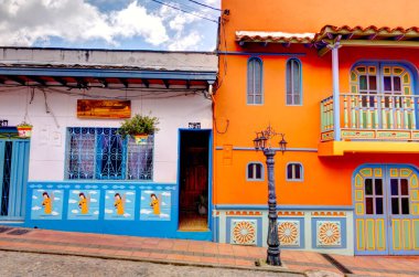 Guatape, Antioquia, Colombia - May 2019 : Colorful village in cloudy weather